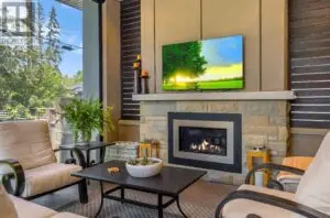 a living room with a fireplace and a television